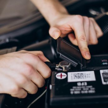 Repair man making car service